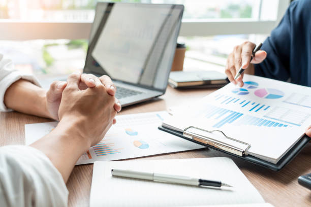 istock Cropped Hands Of Businessmen Working In Office 1180944316