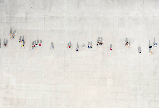 istock High Angle View Of People walking On Street 1180947933
