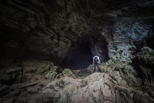 Man standing in cave