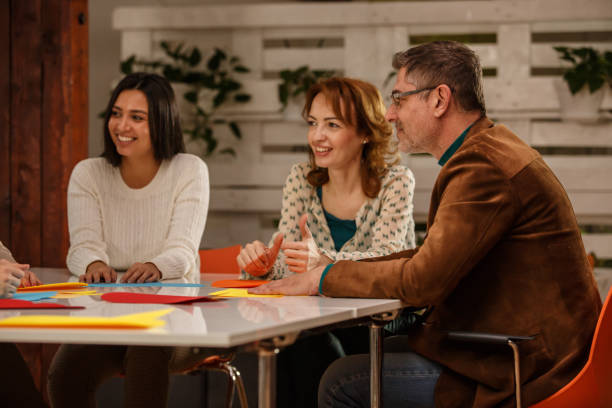 istock Smiling colleagues during a business meeting 1180949471