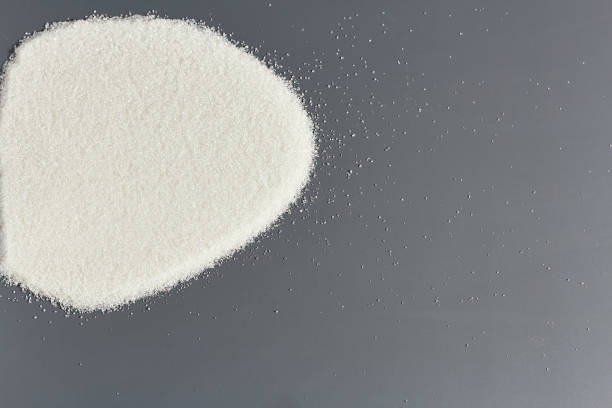 istock Sugar on a dark background. Diet, sweet life 1180949802