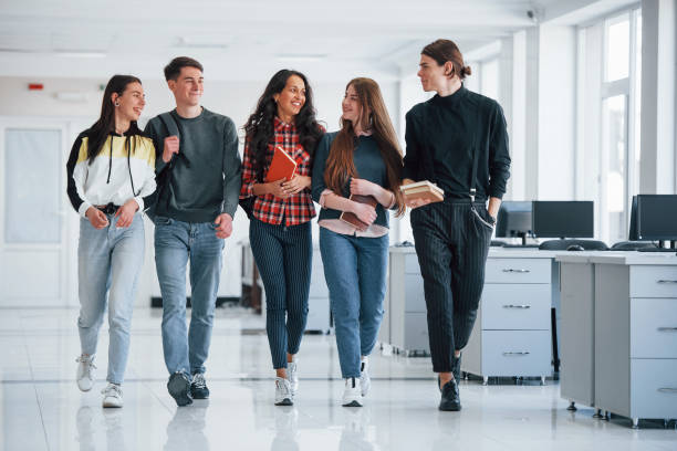 istock Work will not wait. Group of young people walking in the office at their break time 1180950497