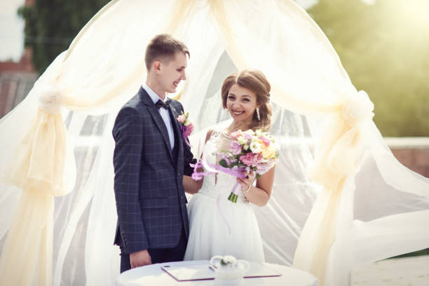 istock Wedding. Happy couple. Two lovers are smiling 1180954122