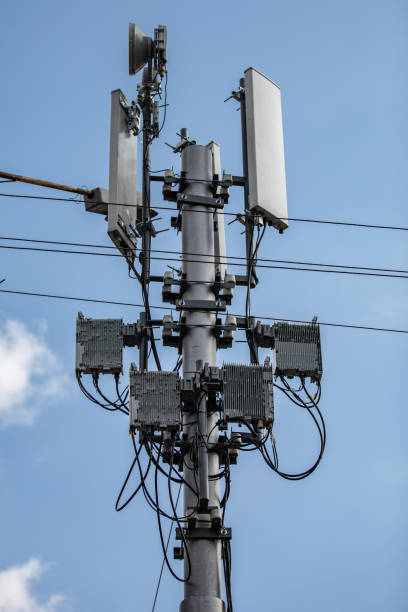istock cellular signal repeater under a blue cloudy sky 1180954768