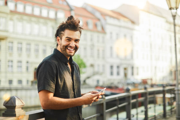 Lifestyle young man in the streets of Berlin. Lifestyle young man in the streets of Berlin. short sleeved stock pictures, royalty-free photos & images