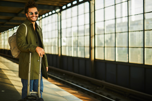 Lifestyle young man in the streets of Berlin.
Young traveler in Berlin's train station.
Young tourist portrait at the train platform.