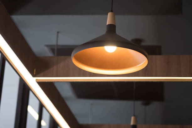 istock Black decorative lamp hanging from the ceiling. Modern lamp 1180956215