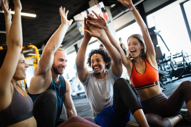 istock Healthy young athletes friends doing exercises at gym. 1180956936