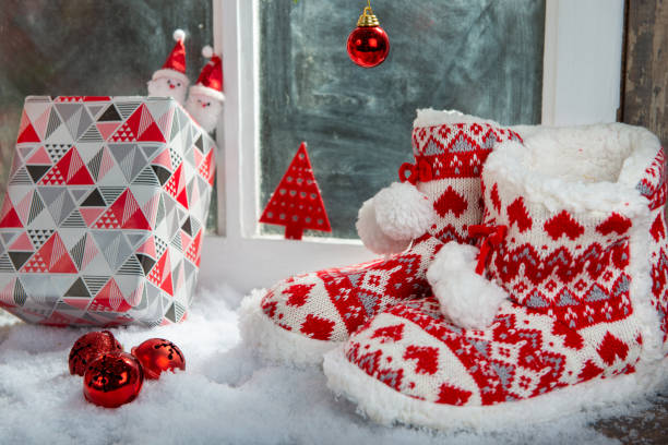 istock Merry Christmas concept greeting postcard with the  slipper shoes 1180957974