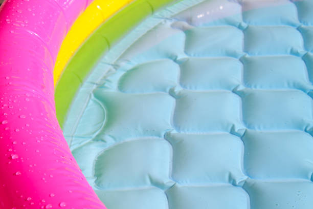 istock Bright blue paddling pool surface with water ripples 1180958148