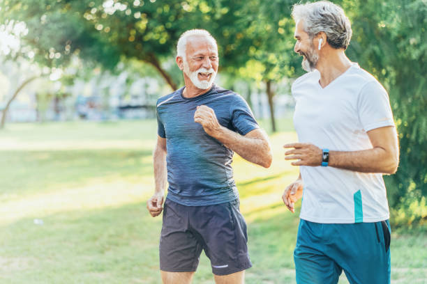 istock Senior friends jogging 1180959135
