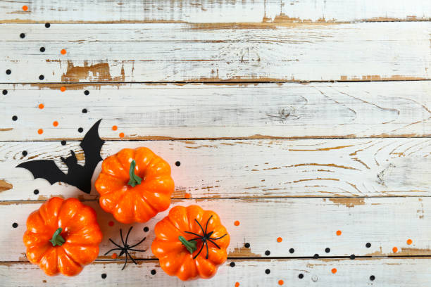 istock Bright colorful candy corn scattered on textured surface as symbol of autumnal holidays. 1180960689