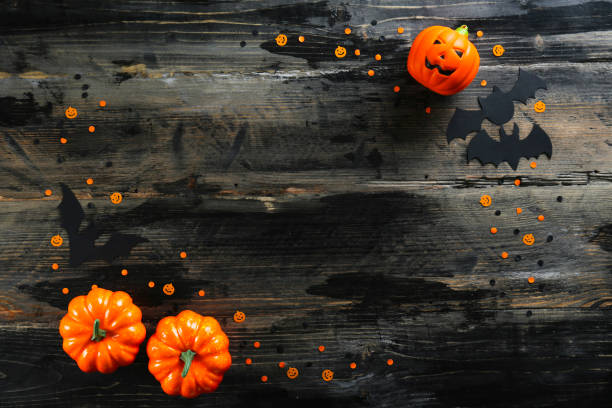 istock Bright colorful candy corn scattered on textured surface as symbol of autumnal holidays. 1180960710