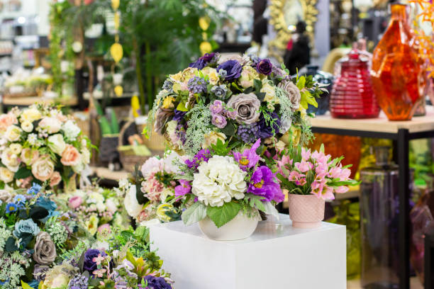 istock Bouquets of artificial flowers, rose hydrangea violet crocus, floristry. flower sales, interior design 1180961202