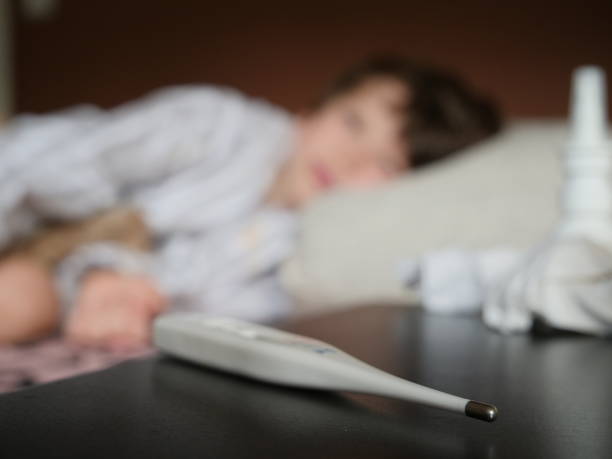 istock Ill 5 yearsold child lying in bed 1180962387