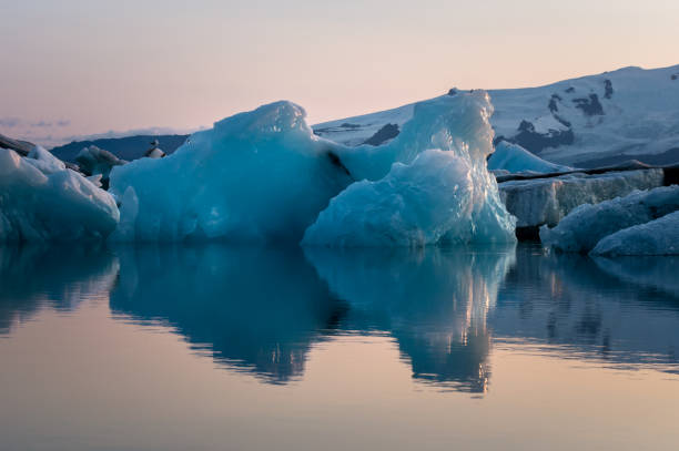 istock Melting iceberg floating on the ocean 1180965097