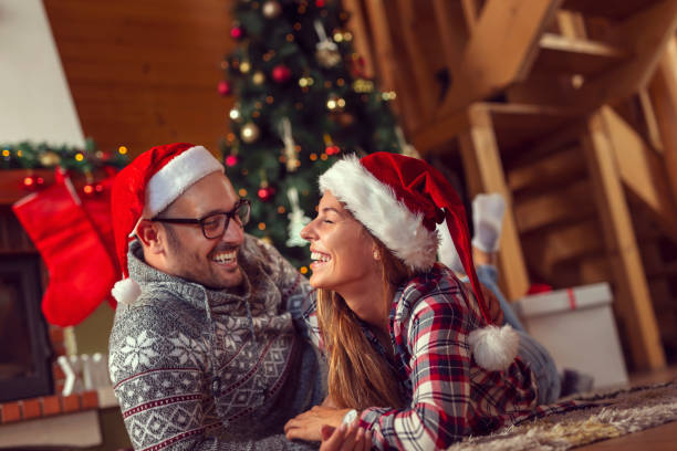 istock Couple at home on a Christmas morning 1180966969