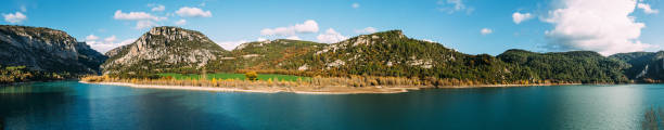 istock Calm lake near mountains in nature 1180967581