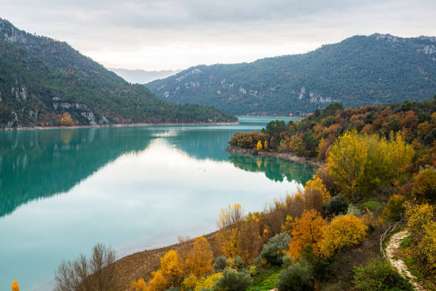 istock Calm lake near mountains in nature 1180967932