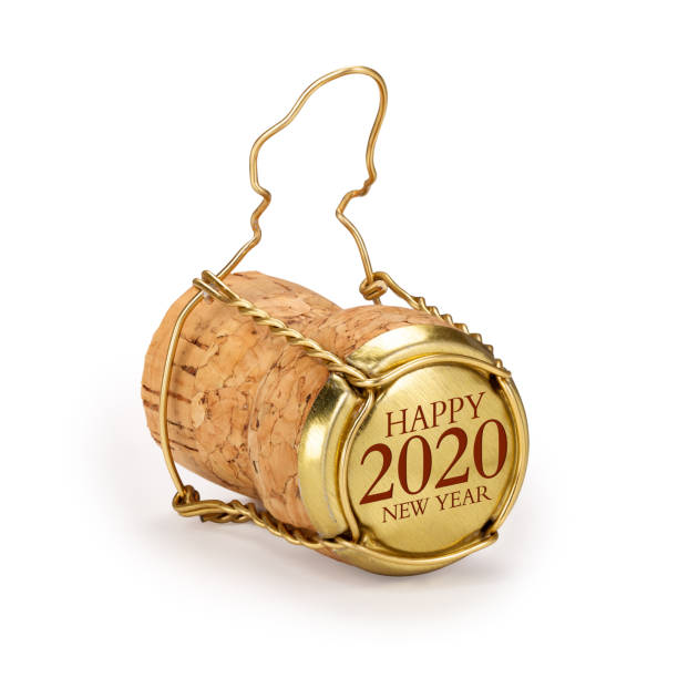 istock Champagne cork isolated, 2020 on golden cap, includes clipping path. 1180970006