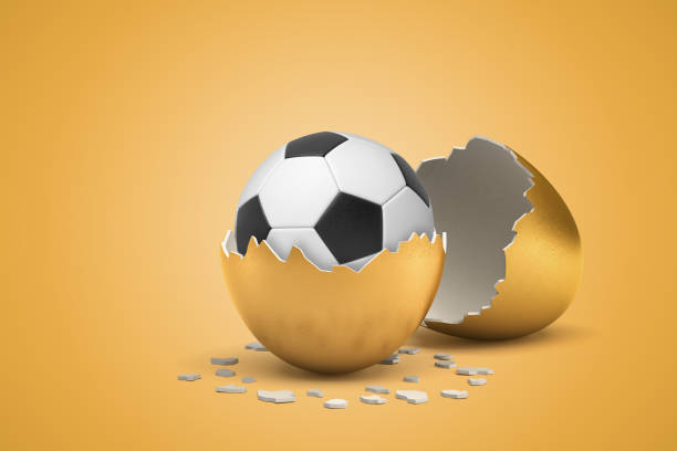 istock 3d rendering of football that just hatched out from golden egg. 1180971699