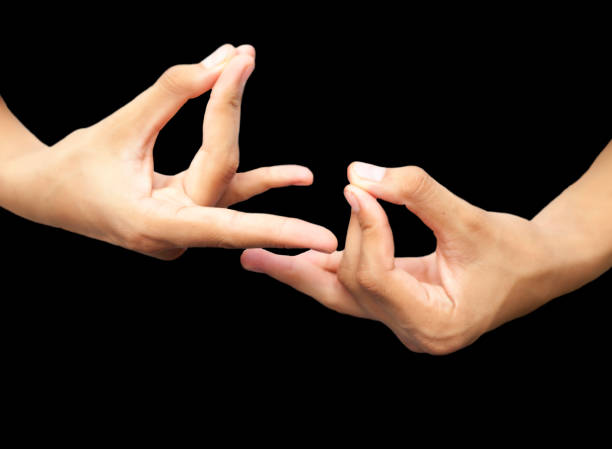 istock Pair of male hands isolated on black joined and doing Pushan mudra. Horizontal shot. 1180971802
