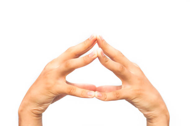 istock Pair of male hands isolated on white joined and doing Hakini Mudra. Horizontal shot. 1180971810