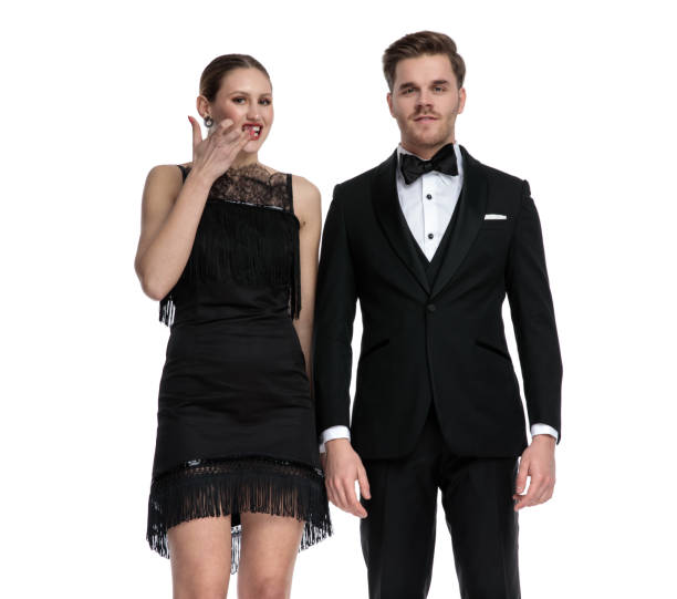 istock Boyfriend posing besides his girlfriend who is picking her teeth 1180972415