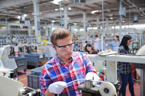 istock Manual worker man working at manufacturing factory 1180973299
