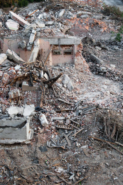 istock The ruins of the house. Bricks, plaster, boards, iron 1180973479