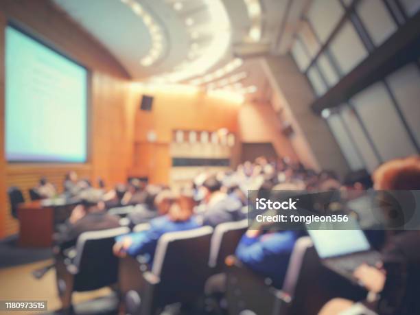 Blur Of Auditorium Room Use For Present Meeting Background Stock Photo - Download Image Now