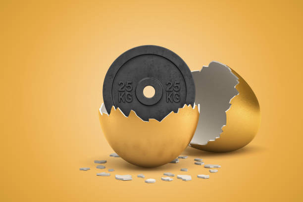 3d rendering of 25 kg weight plate hatching out of golden egg on yellow background stock photo
