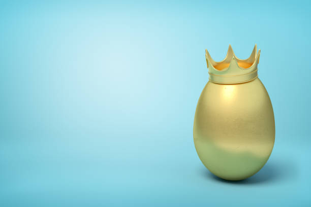 istock 3d rendering of golden chicken egg wearing golden crown on light blue background. 1180977995