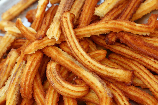 istock Close up sweet fresh churros snack on tray 1180978130