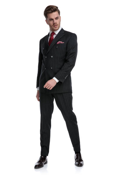 istock young modern businessman wearing double breasted suit and red tie 1180978926