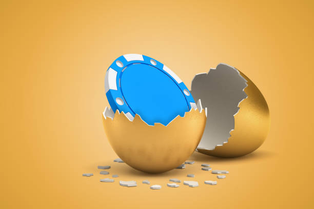 istock 3d rendering of blue casino chip that just hatched out from golden egg. 1180980424