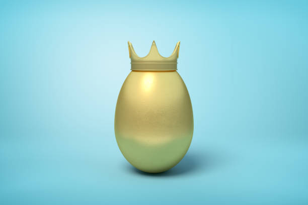 istock 3d rendering of golden chicken egg wearing golden crown on light blue background. 1180981137