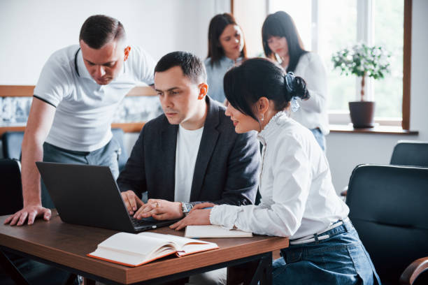 istock Business people and manager working on their new project in classroom 1180983155