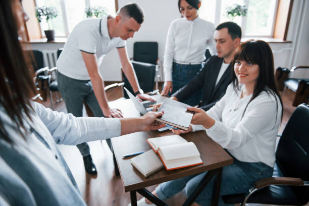 istock Take this notepad. Business people and manager working on their new project in classroom 1180983426