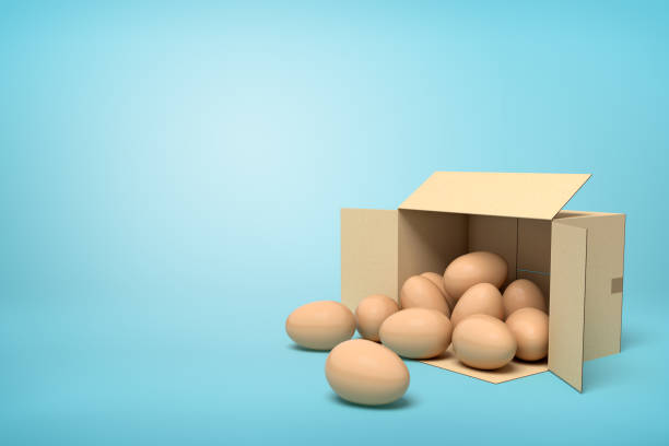 istock 3d rendering of chicken eggs in carton box on blue background. 1180986126