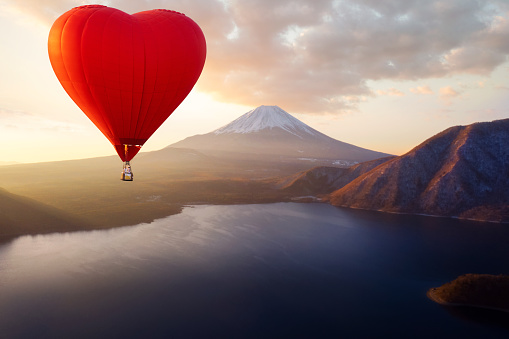 Hot air fly over Fuji mountain in morning sunrise time , Tokyo, japan, this image can use for love, valentine day, landscape, adventure and travel concept