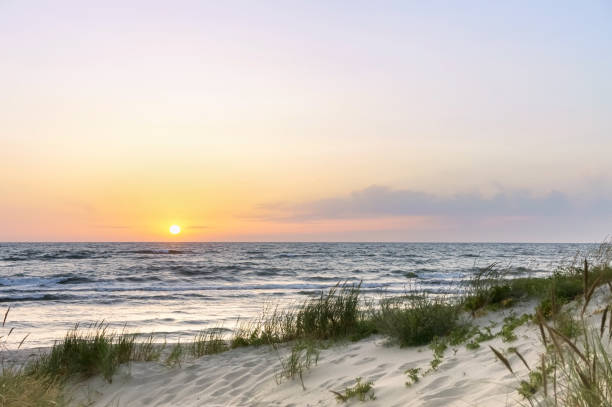 istock the sky is purple from the sunset, sunset on the seashore 1180989634