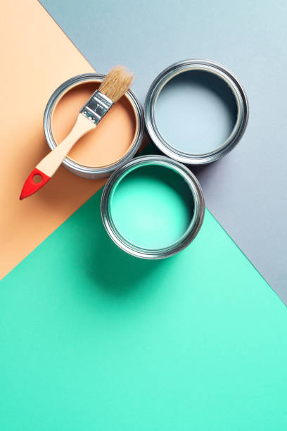Metal paint cans and paint brushes on multicolor background. Top view. Copy space. Trendy green color concept Metal paint cans and paint brushes on multicolor background. Top view. Copy space. Trendy green color concept. bucket photos stock pictures, royalty-free photos & images