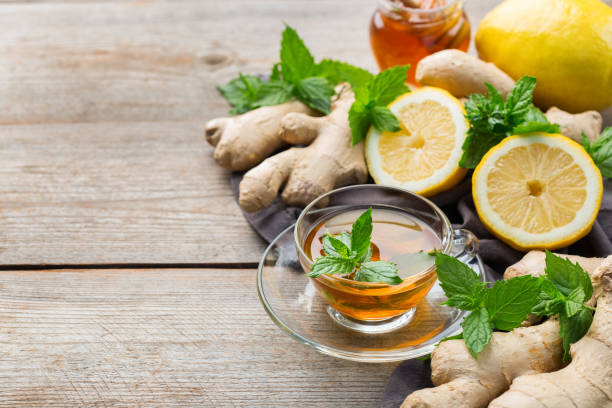 istock Ginger tea with lemon, mint and honey for flu cold 1180989993