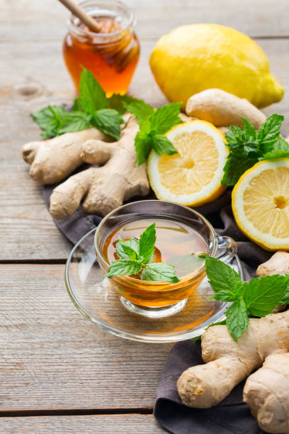 istock Ginger tea with lemon, mint and honey for flu cold 1180990049