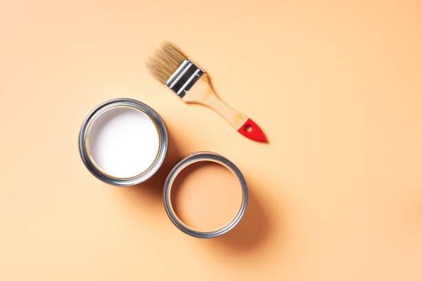 istock Paint brush and open paint can with on pastel background. Top view, copy space. Appartment renovation, repair, building and home design concept. 1180990075