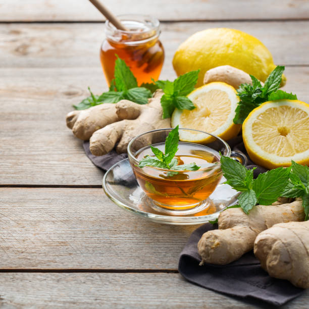istock Ginger tea with lemon, mint and honey for flu cold 1180990100