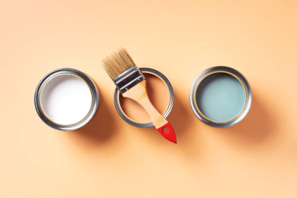 istock Paint brush and open paint can with on pastel background. Top view, copy space. Appartment renovation, repair, building and home design concept. 1180990135
