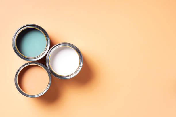istock Open paint can with on pastel background. Top view, copy space. Appartment renovation, repair, building and home design concept. 1180990149
