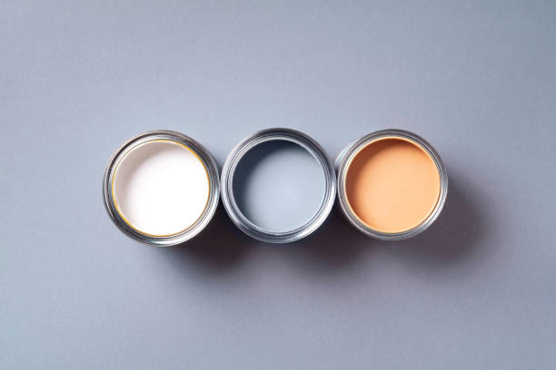 istock Open paint cans with on pastel background. Top view, copy space. Appartment renovation, repair, building and home design concept. 1180990153